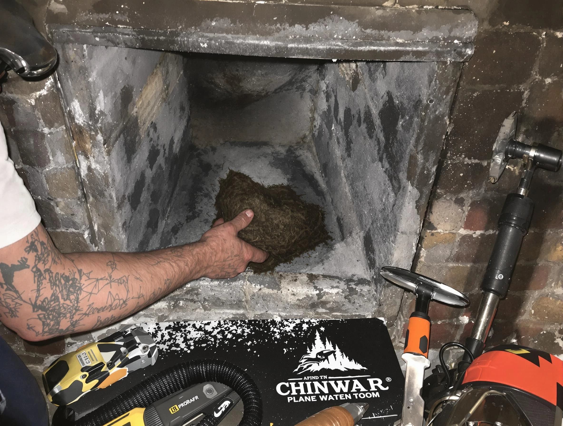 Center Point Chimney Sweep safely removing debris and screening chimney in Center Point, AL
